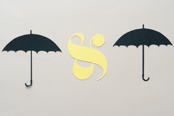 ampersand symbol and paper umbrella shapes