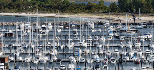 Many yachts and sailboats in marina. Vacation, cruising and travel concept 
