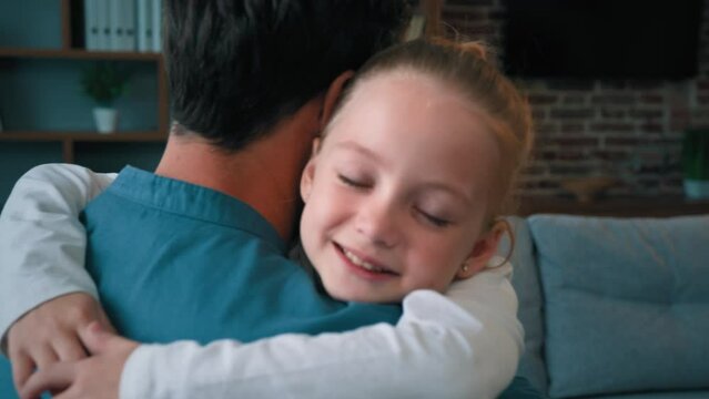 Cute loving kid pretty daughter caucasian girl hug adult daddy kiss male parent in cheek family meeting at home happy child embrace single father expressing love tenderness harmony people relations