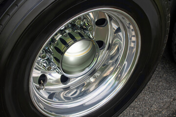 Fototapeta Semi-trailer truck detal metal chrome close up of a wheel on tramac obraz