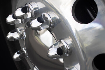 tractor trailer truck with big chrome silver wheel rim and rubber tire