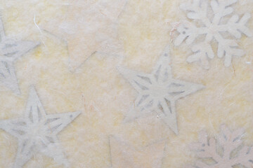 Fototapeta na wymiar background with stars and snowflakes on yellow