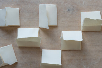 folded and torn paper pieces