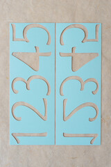 blue paper stencil with numbers