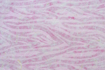 tissue paper on pink paper with stripes