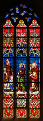 Stained-glass window depicting The Presentation of the Blessed Virgin Mary at the Temple....