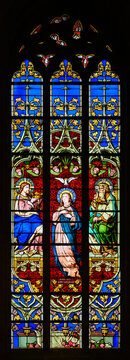 Stained-glass window depicting the Assumption and Coronation of the Virgin Mary. Notre-Dame de Luxembourg (Notre-Dame Cathedral in Luxembourg). 2021/07/04