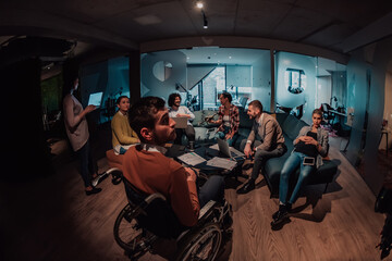 Business persons with a disability at work in modern open space coworking office on team meeting using virtual reality goggles.