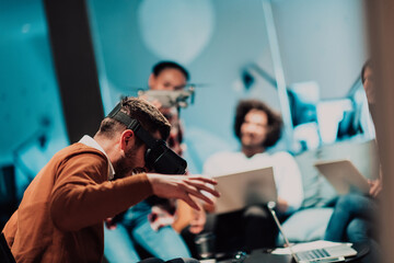 Business persons with a disability at work in modern open space coworking office on team meeting using virtual reality goggles.