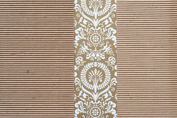corrugated brown paper with decorative scrapbook paper