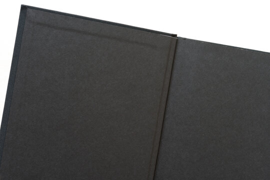 open hardcover book with black endpapers