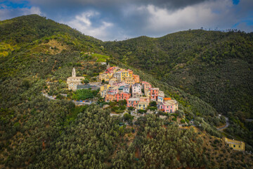 Fototapeta na wymiar A small village lavaggiorosso high up in the mountains near Levanto on the Ligurian coast. Secluded and almost forgotten it looks at us. Aerial drone picture. September 2021