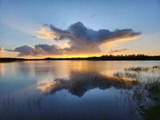 Colorful sunrise coudscape over Nine Mile Pond in Everglades National Park, Florida on sunny autumn morning.