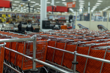shopping carts in a supermarket - obrazy, fototapety, plakaty