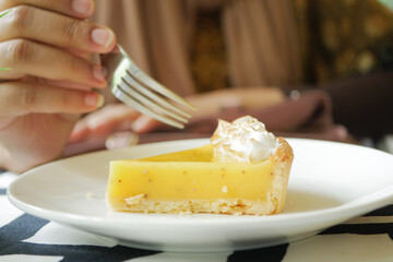 over head view of women eating lemon tart 