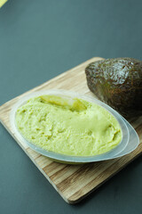 avocado spread on a chopping board 