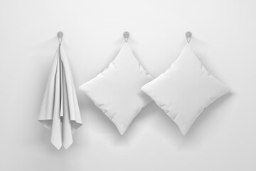 Mockup template with one hanging towel and two white pillows