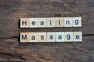 Healing Massage text on wooden square, health inspiration quotes