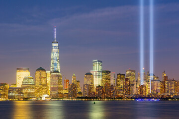 Night view of the 911 memorial light and the New York City skyline