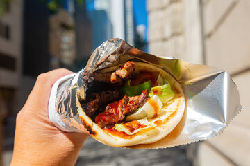 Close up shot of Mexican style beef wrap taco