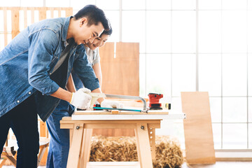 Southeast asian family father and son diy or repair for crafts skill at home workshop