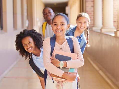 School, friends and portrait of group of children in hallway excited for lesson, learning and class. Education, friendship and happy young students with backpack, books and ready for primary school