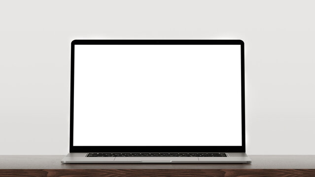 Laptop on wooden table, grey wall background. Laptop with blank white screen mockup on wooden table. Front view laptop, grey background