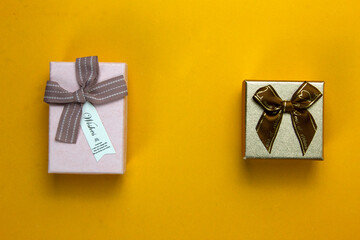 Christmas Gift boxes isolated on yellow background, two Gift used for New Year concepts party design.