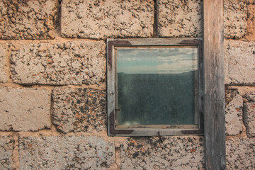 texture of an old cement block wall with window