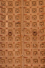 Old historic rusty door exterior view.