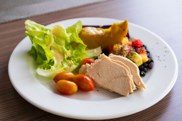 Baked chicken salad or steamed chicken breast and ridgepole with lettuce vegetable steam pumpkin queen tomato fruit sesame black beans and purple sweet potato for healthy clean food and diet breakfast