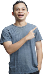 Young asian man over isolated white background surprised pointing with finger to the side