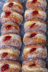 Fresh Jam doughnuts (Donuts) on a bakery stall at a food market