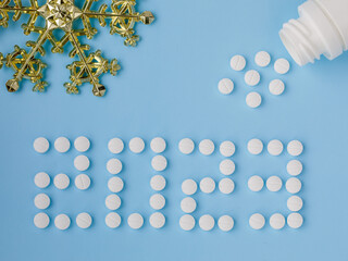 2023 Happy New Year banner for health care and medical concept. Number 2023 made from tablets,...