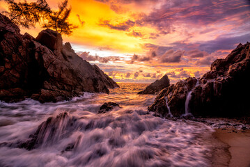 Fototapeta na wymiar Scene of beautiful sunset and sea waves at banana beach, Phuket , Thailand.