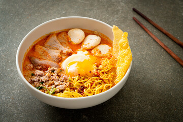 egg noodles with pork and meatball in spicy soup