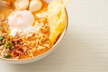 instant noodles with pork and meatballs in spicy soup