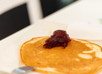 Close up shot of a home made pancake on the plate. Food
