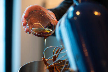 Maple syrup being poured into blender.  