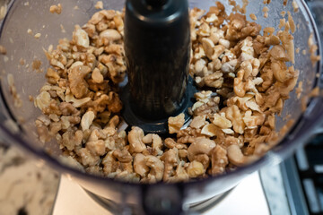 Looking down into blender with walnuts.  
