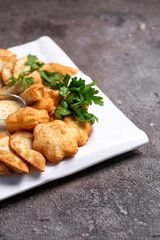 National Kazakh pastries in a plate on the table.