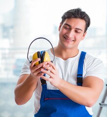 Worker with noise cancelling headphones