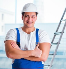 Young worker with safety helmet hardhat