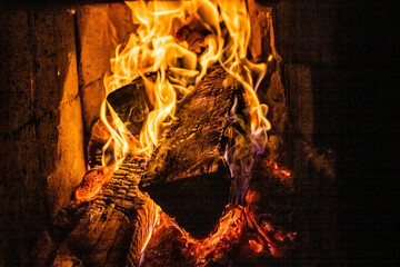 Ignition of firewood in a stone oven at home.