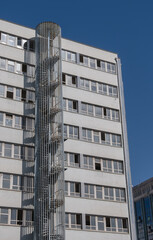 Fototapeta premium circular metal fire escape. multi-floor apartment. spiral staircase,