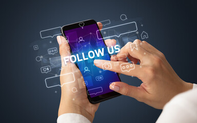 Hand using smartphone with social media concept