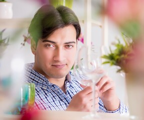 Young handsome man shopping in shop