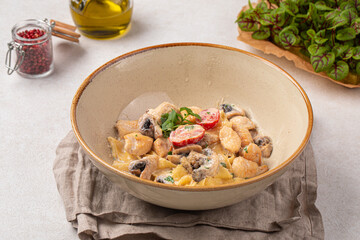 Portion of gourmet alfredo pasta with chicken and mushrooms