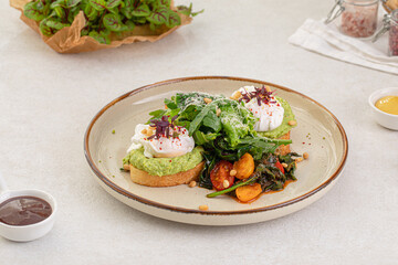 Portion of gourmet avocado toast with poached egg