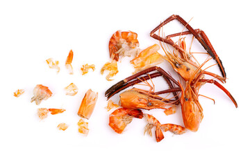 Shrimp heads and shrimp shells, food waste, leftovers, waste. Natural seafood. Lunch. Dinner isolated on white background.